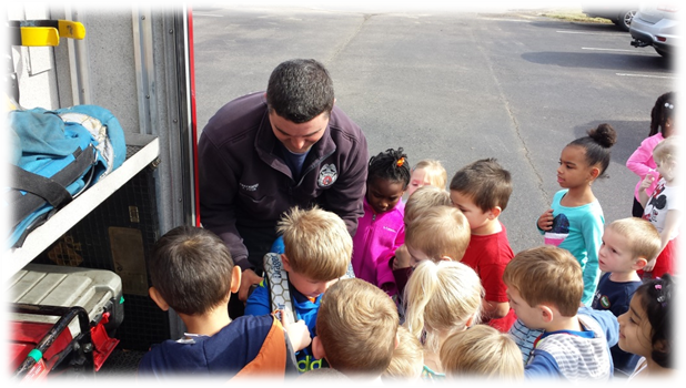 Fire Fighter Alston Presents to Elementary Students About Fire Safety